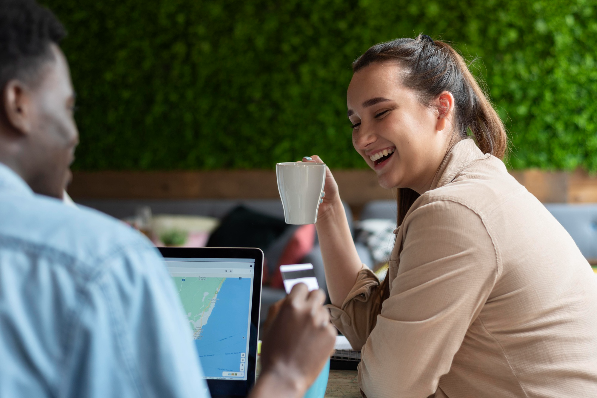 Two people chatting over coffee